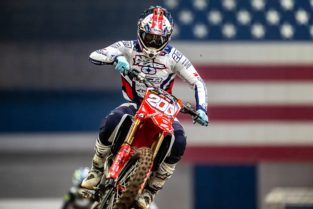 Ryan Breece charges front-on in front of the flag