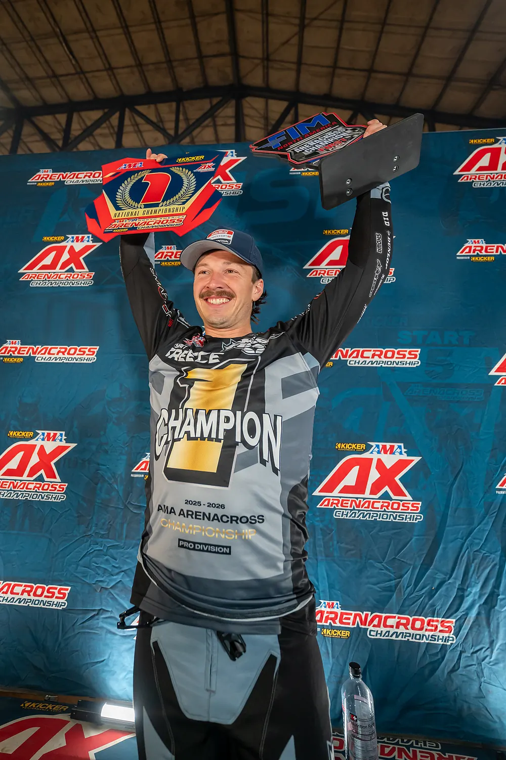 Ryan Breece lifts the championship #1 plates