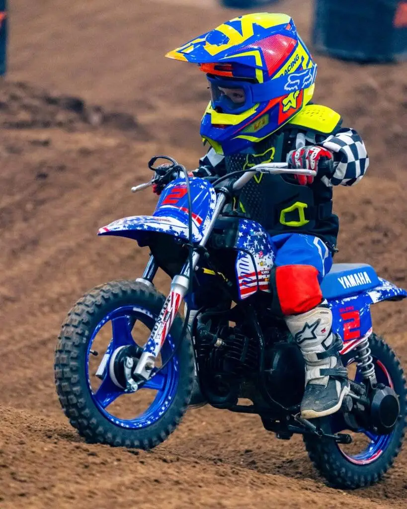 A young rider on a dirt bike.