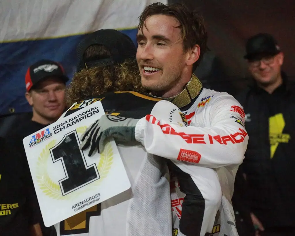 Kyle Peters and Izaih Clark hugging after Kyle won the 2024 AMA Arenacross Championship.