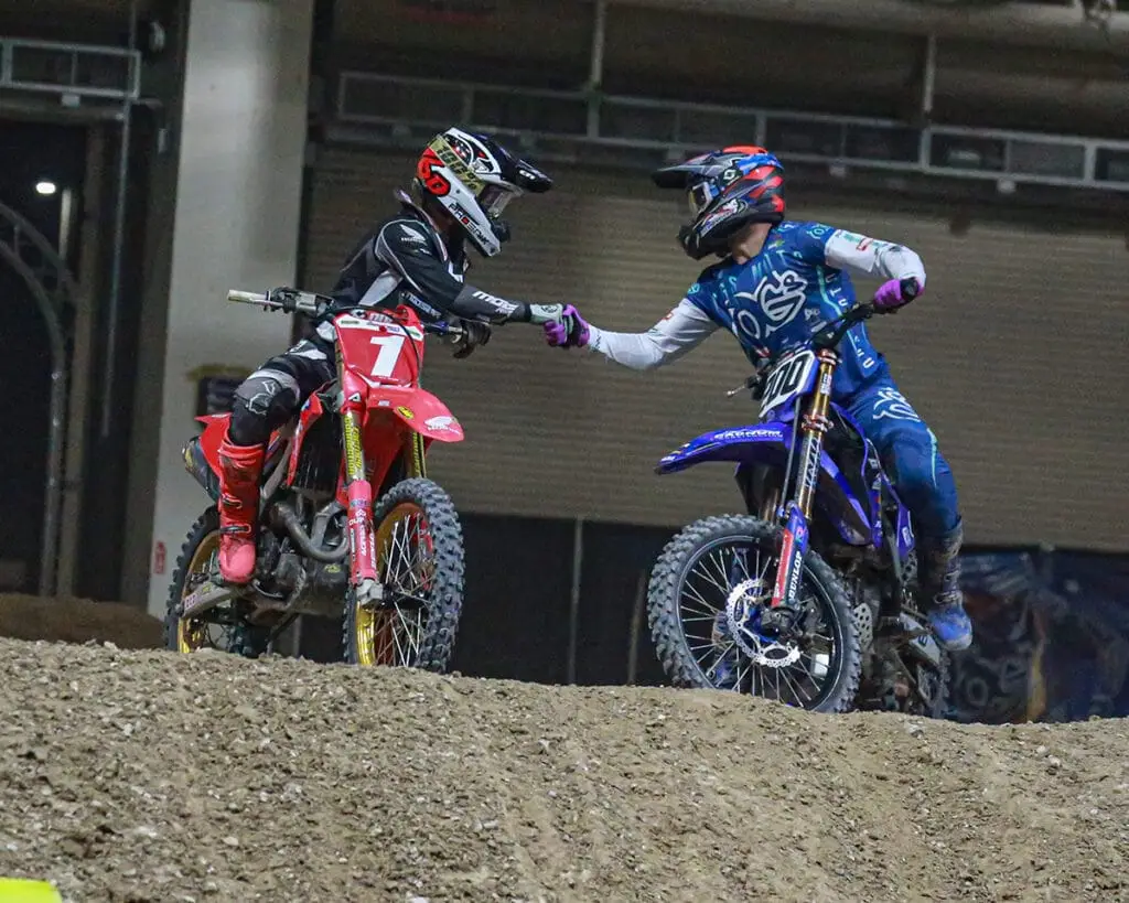 Kyle Peters and Ryan Breece shaking hands after Kyle won the 2024 AMA Arenacross Championship.